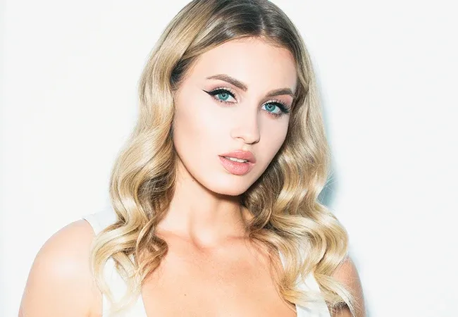 Close-up of cheeks and lips with restored volume from hyaluronic acid dermal fillers